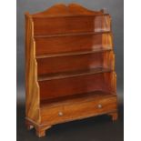 A 19th Century mahogany waterfall open bookcase with five tiers over a single drawer on bracket feet