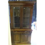 A Victorian mahogany bookcase cabinet wi