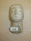 An ethnic carved stone head