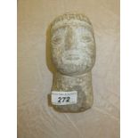 An ethnic carved stone head