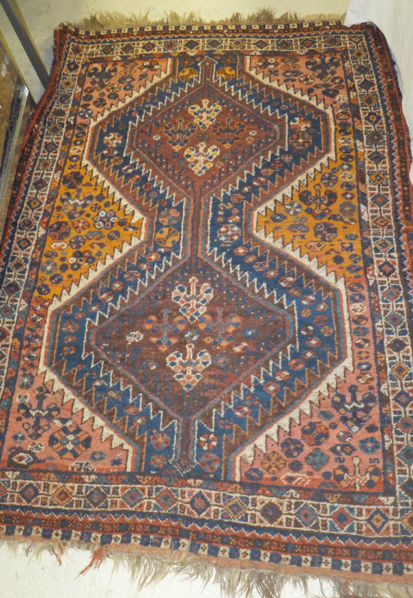 A Shiraz rug, the central panel set with