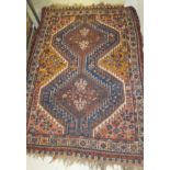 A Shiraz rug, the central panel set with