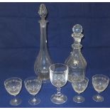 A glass decanter with facet cut sides, a