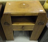 A 1930's oak cabinet with single drawer