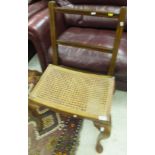 A mahogany cane seated stool on cabriole