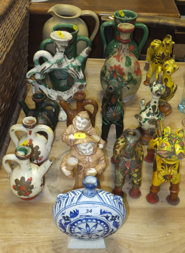 A collection of Peruvian style pottery ornaments, to include animals, vases, jugs, etc, together