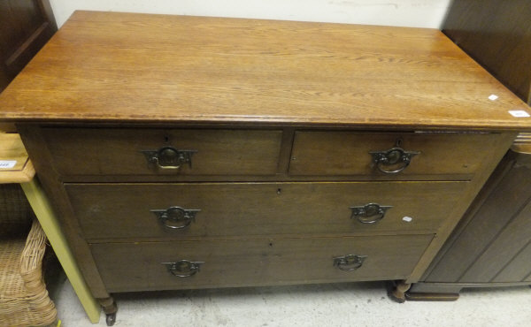 A circa 1900 oak chest of two short and