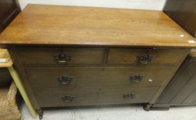 A circa 1900 oak chest of two short and