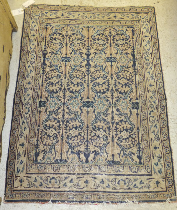 A Persian rug, the central floral and fo