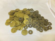 A collection of 19th Century Chinese bronze or brass coinage, and a collection of brass gaming
