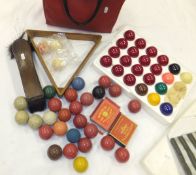 Three early 20th Century ivory billiard balls, a harlequin set of snooker balls, a triangle and "