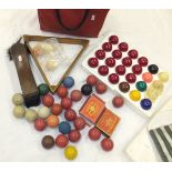 Three early 20th Century ivory billiard balls, a harlequin set of snooker balls, a triangle and "