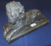 A cold cast bronze figure of a recumbent