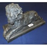 A cold cast bronze figure of a recumbent