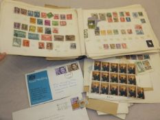 A stamp album containing various mid 20t