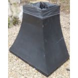A black painted metal fireplace/chimney