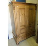 A modern Continental pine armoire with t