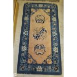 A Chinese rug with three medallions on a
