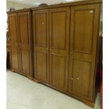 A Younger Furniture bedroom suite comprising triple wardrobe, double wardrobe, dressing chest, chest