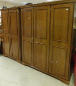 A Younger Furniture bedroom suite comprising triple wardrobe, double wardrobe, dressing chest, chest