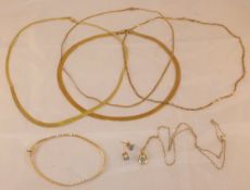 Four 9 carat gold necklaces, together with a bracelet and a 9 carat gold and stone set pendant and