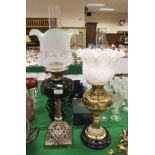 A Victorian oil lamp with green glass re