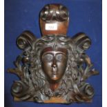 An Irish carved mahogany head finial