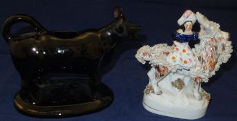 A Staffordshire pottery figure of a girl