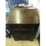 A 19th Century oak bureau of small propo