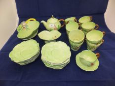 A collection of Carlton ware leaf-moulded tea wares to include teapot, cups and saucers, milk jug,