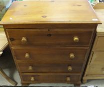 A pine chest of four long drawers with t