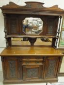 A late Victorian walnut sideboard with m