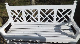A modern white painted latticework back