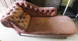 A Victorian buttoned upholstered scroll