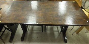 A rectangular oak refectory style dining