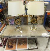 A pair of table lamps decorated with sun