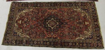 A Persian Hamadan carpet, the central me