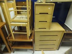 Two beech framed side chairs, together with a light oak chest of four drawers, bedside chest of
