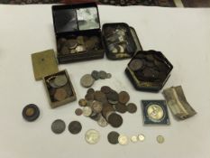 A box of assorted coinage to include car