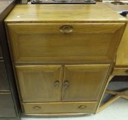 An Ercol light elm cabinet with fall fro