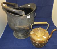 A Middle Eastern copper and brass kettle