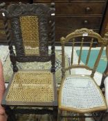 A carved oak hall chair with caned seat