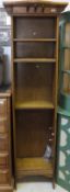 A circa 1900 oak Arts and Crafts style open bookcase with adjustable shelving of slim proportions