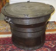An African drum style table CONDITION REPORTS Some wear and scuffs, some chips.  Section of