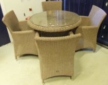 A faux canework garden table and four ar