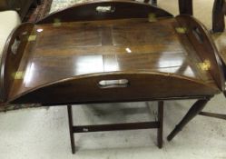 A 19th Century mahogany butlers tray raised on an associated folding base CONDITION REPORTS The tray