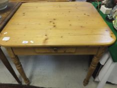 A pine kitchen table, the plain top abov