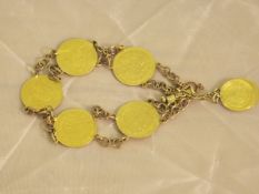 A bracelet made up of Ahmad Shah Islamic Quajar gold coins and Iranian gold coins CONDITION