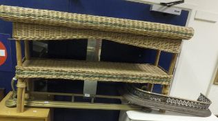 A wicker and bamboo two tier hall table,