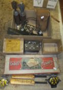 Two mortar bomb shell casings, a crystal radio set, various ration books, two AA badges, vintage